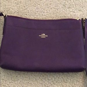 Eggplant, purple Coach crossbody purse.